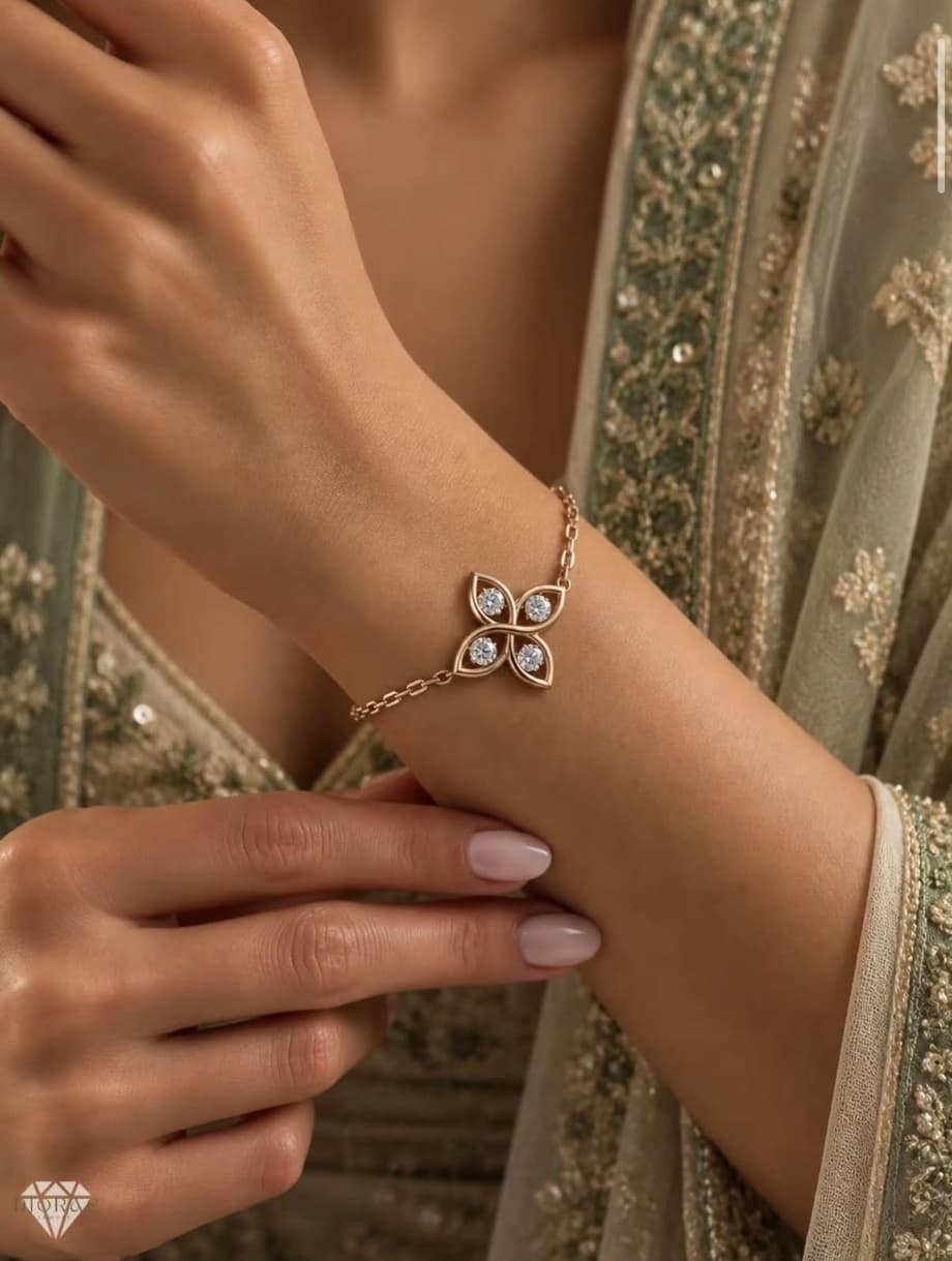 Trèfle gold clover bracelet with diamond accents on the wrist against embroidered festive fabric